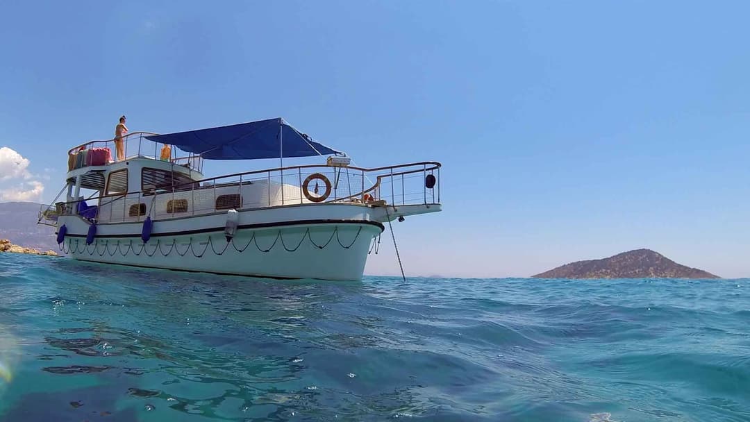 Kalkan's Turquoise Waters: 12-Person Luxury 13m Boat for Full-Day Rentals, Sunset Tours, Kalkan Bays Tours, Onboard Proposals, Birthdays & Bachelor Parties