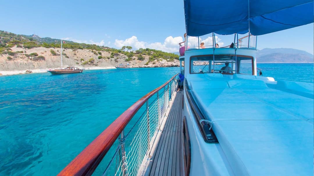 Kalkan's Turquoise Waters: 12-Person Luxury 13m Boat for Full-Day Rentals, Sunset Tours, Kalkan Bays Tours, Onboard Proposals, Birthdays & Bachelor Parties